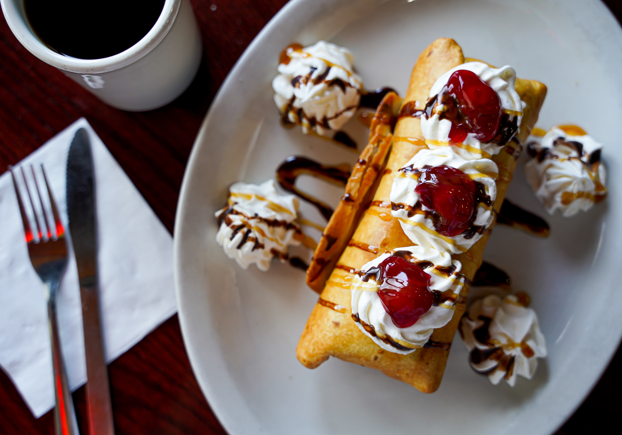 Delicious waffles with whipped cream and cherries
